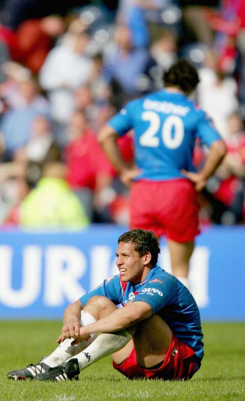 Julien Arias sits dejected at the end of the Heineken Cup final