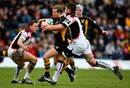 Wasps' Dave Walder is tackled by Edinburgh's Hugo Southwell