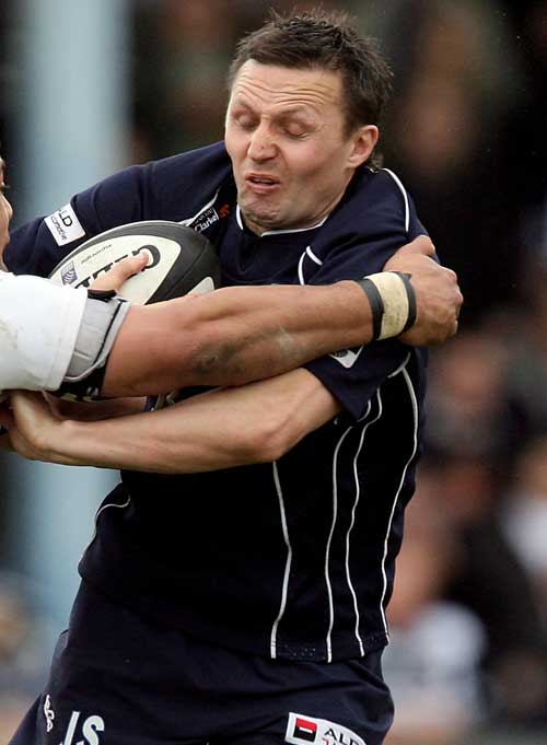 Bristol's Jason Strange is wrapped up by the Worcester defence