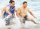 Blues playmaker Jimmy Gopperth runs through the surf during pre-season training