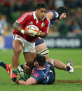 The Lions' Manu Tuilagi charges upfield against the Rebels