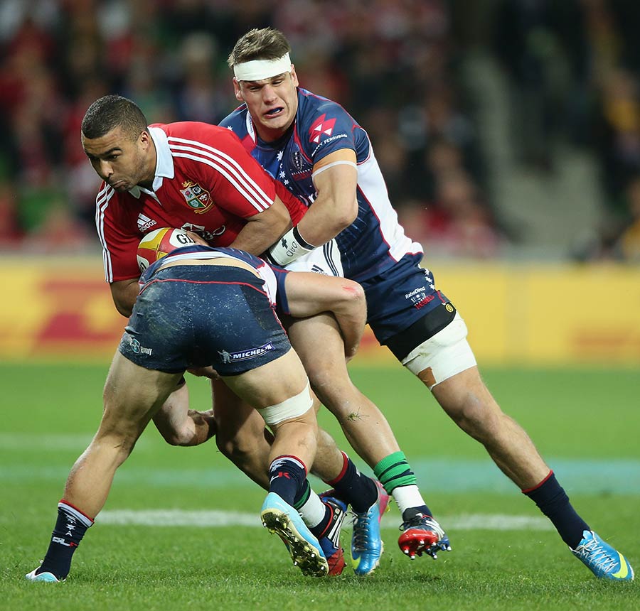 Lions winger Simon Zebo is tackled by his Rebels opposite Lachlan Mitchell, Melbourne Rebels v British & Irish Lions, AAMI Park Stadium, Melbourne, June 26, 2013