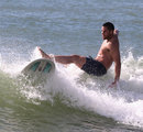 Sean Maitland comes a cropper in the surf on the coast at Noosa