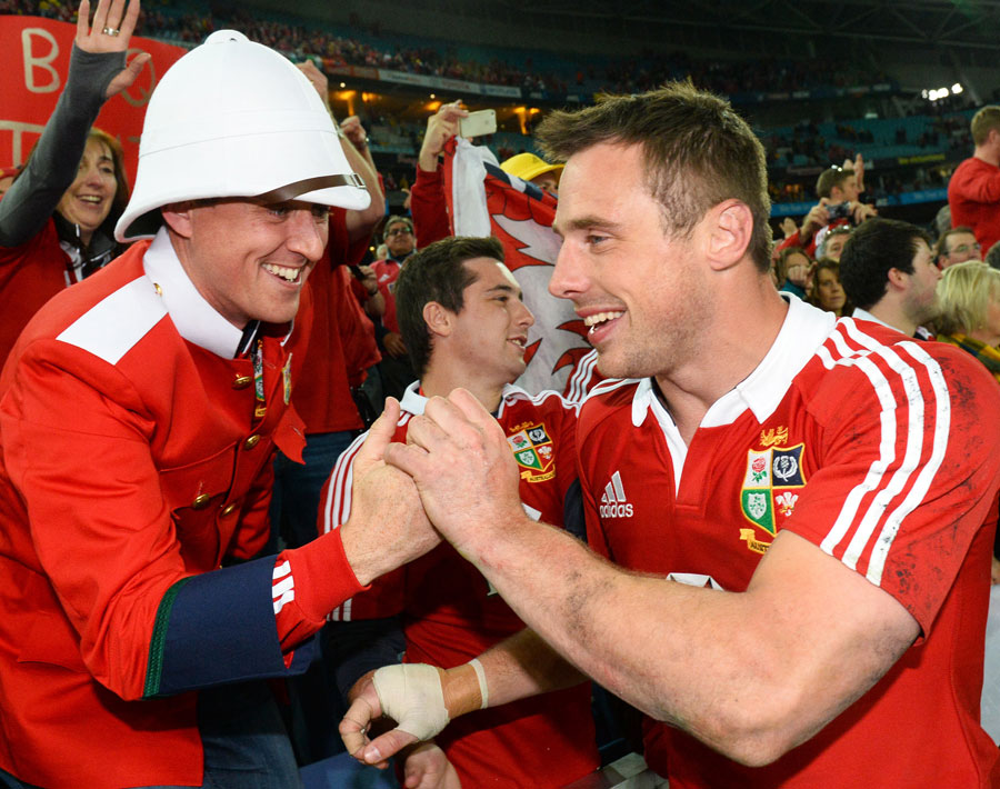 Lions winger Tommy Bowe celebrates with a fan