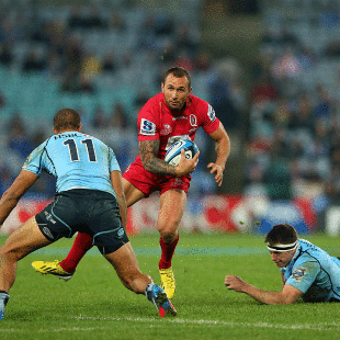 The Reds' Quade Cooper steps past Jed Holloway and Peter Betham, New South Wales Waratahs v Queensland Reds, Super Rugby, ANZ Stadium, Sydney, July 13, 2013