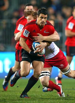 The Crusaders' Dan Carter breaks a tackle from the Reds' Ed Quirk, Crusaders v Queensland Reds, Super Rugby, Super Rugby qualifiers, AMI Stadium, Christchurch, July 20, 2013