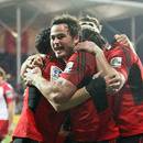 The Crusaders' Zac Guildford congratulates Dan Carter for his try