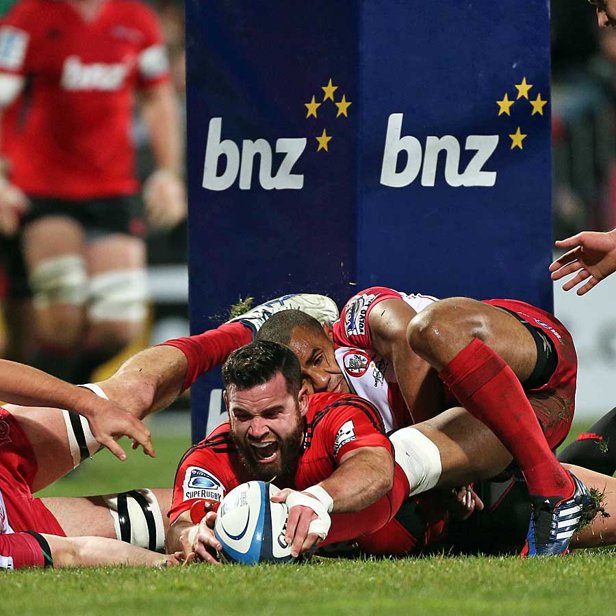 The Crusaders' Ryan Crotty scores a try against the Reds