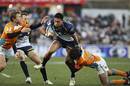 The Brumbies' Christian Lealiifano punches a hole in midfield