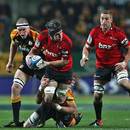 The Crusaders' Matt Todd charges forward against the Chiefs