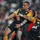 The Chiefs' Aaron Cruden celebrates a try with Liam Messam