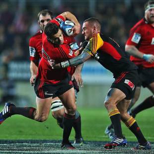 The Chiefs' Aaron Cruden tackles Daniel Carter, Chiefs v Crusaders, Super Rugby, Super Rugby semi-final, Waikato Stadium, Hamilton, July 27, 2013