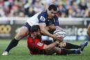 The Brumbies' George Smith dominates Ryan Crotty at a breakdown