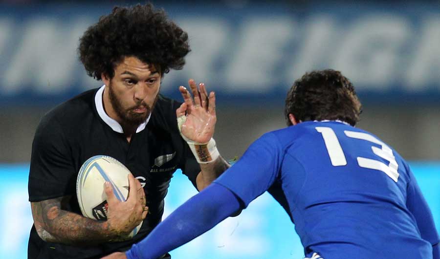 New Zealand's Rene Ranger tries to evade the French defender