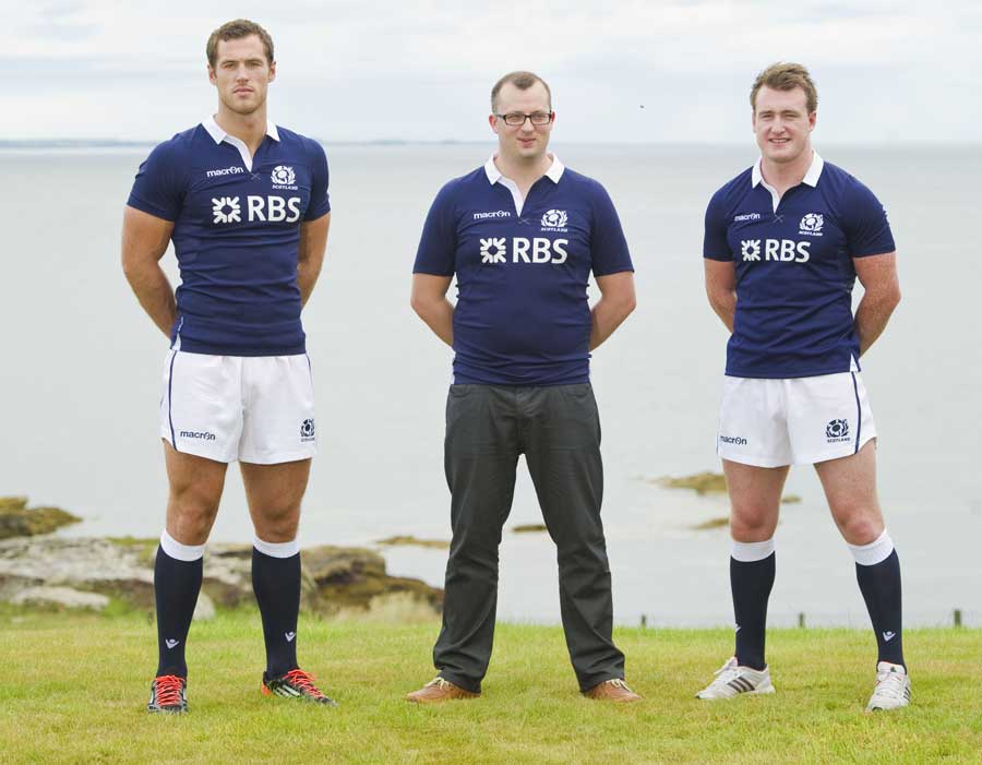 Tim Visser stands alongside competition winner Stuart Gray and Stuart Hogg in Scotland's new home shirt