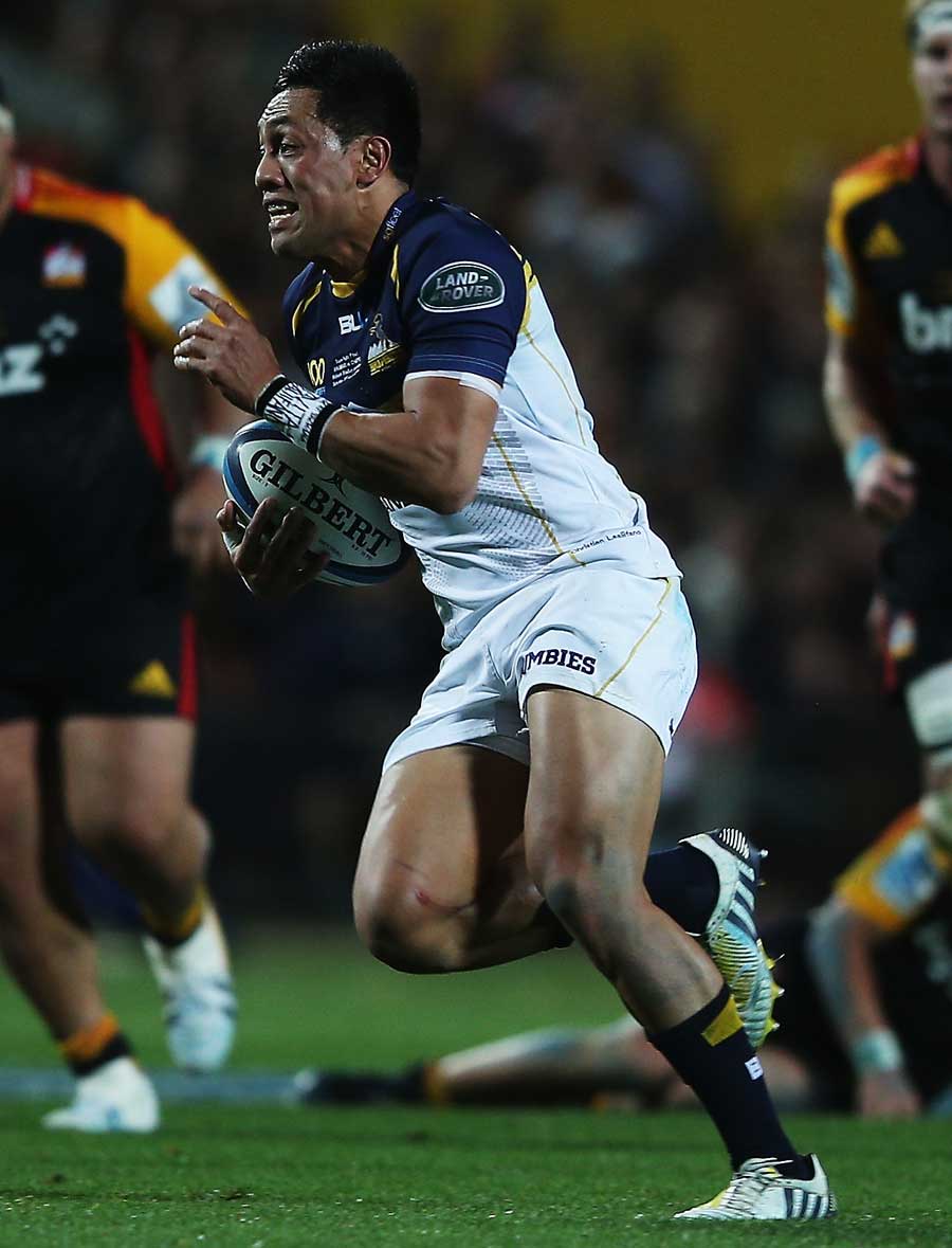 The Brumbies' Christian Lealiifano sprints away for the first try of the game