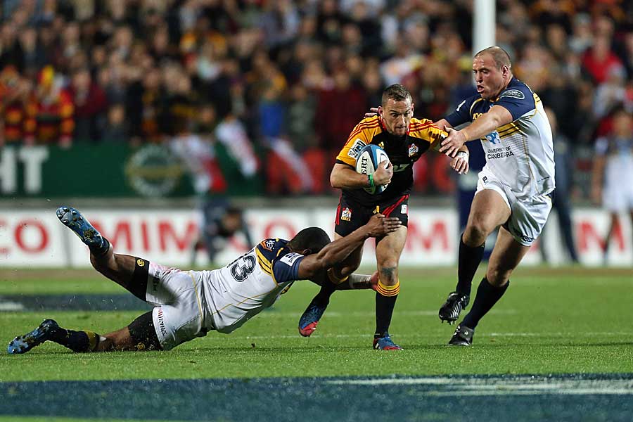 The Chief's Aaron Cruden makes a break against the Brumbies