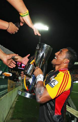 The Chiefs' Bundee Aki celebrates with the Super Rugby trophy, Chiefs v Brumbies, Super Rugby, Super Rugby final, Waikato Stadium, Hamilton, August 3, 2013