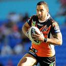Benji Marshall runs with the ball for Wests Tigers against Gold Coast Titans