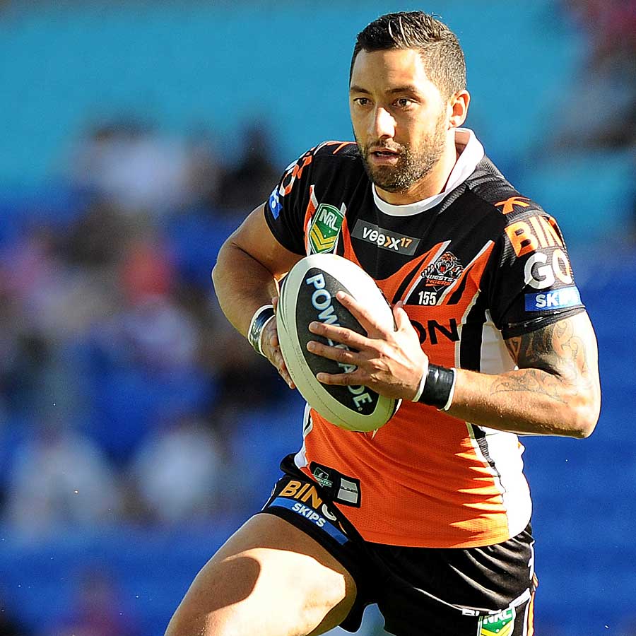 Benji Marshall runs with the ball for Wests Tigers against Gold Coast Titans