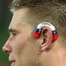 The Rebels' Jason Woodward wears his mouthguard on his left ear