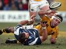 Sale Sharks' Lionel Faure is tackled by Wasps' Joe Worsley 