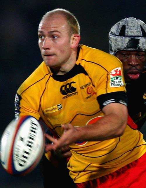 The Dragons' Richard Fussell is tackled by Wasps' Serge Betsen