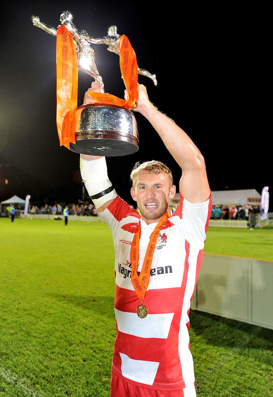 Gloucester captain Martyn Thomas lifts the Premiership Rugby 7s silverware
