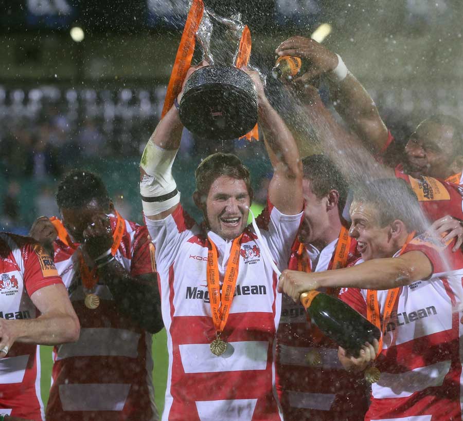 The champagne is sprayed as Gloucester lift the Premiership Rugby 7s silverware