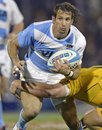 Argentina's Gonzalo Camacho rides a tackle