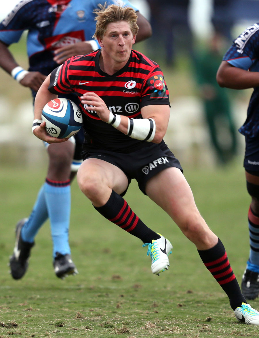 Saracens winger David Strettle bursts through the College Rovers defence