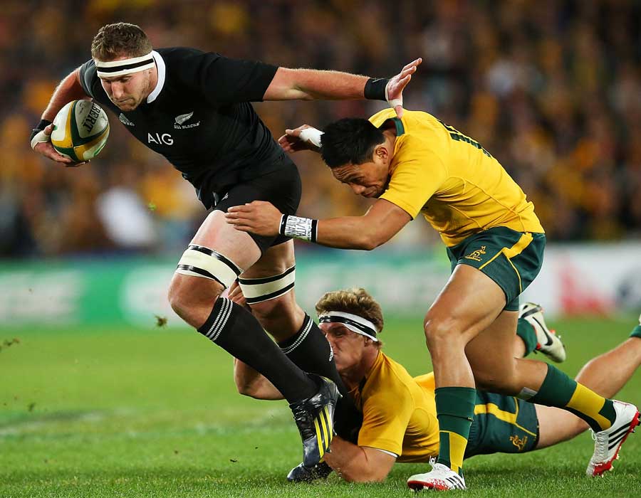 New Zealand's Kieran Read charges through the Australia defence
