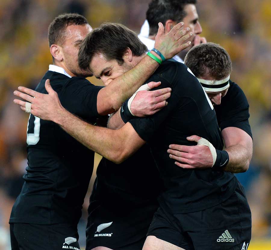 New Zealand's Conrad Smith is congratulated on his try