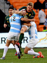 South Africa's Jean de Villiers is shackled by the Argentina defence