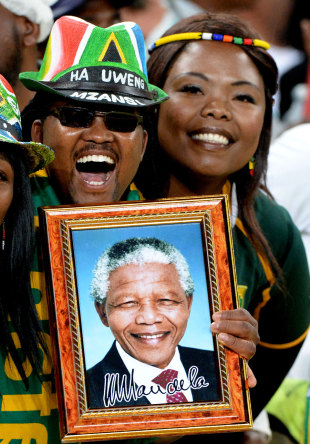 South African supporters hold a portrait of former president Nelson Mandela, South Africa v Argentina, Rugby Championship, FNB Stadium, Johannesburg, August 17, 2013