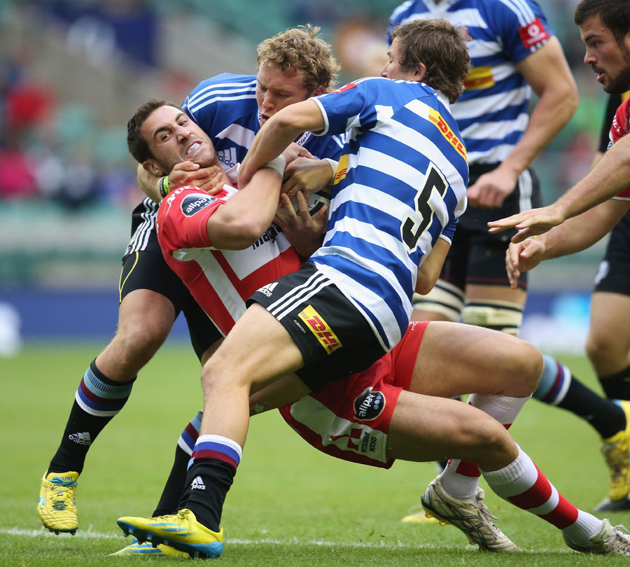 Gloucester's Matt Cox is held by the Western Province defence