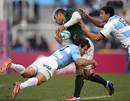 Argentina's Nicolas Sanchez and Lucas Gonzalez Amorosino tackle South Africa's Bryan Habana