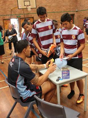 Israel Folau signs autographs for students at Fairfield High School, Fairfield, Sydney, August 29, 2013
