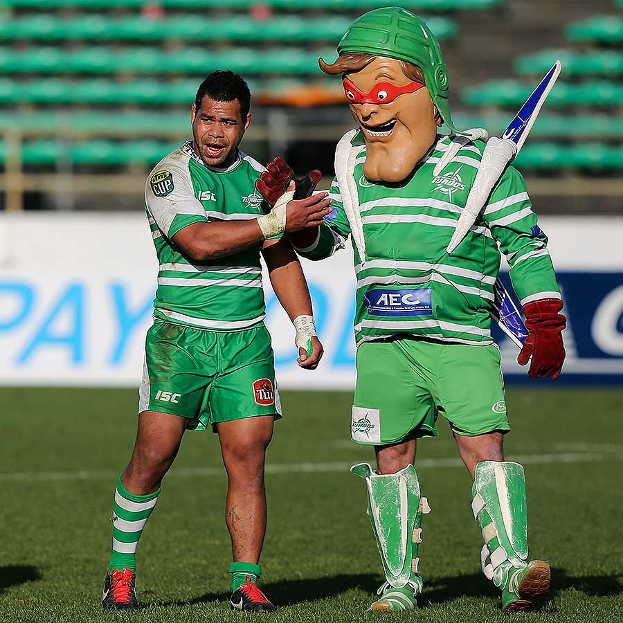 Manawatus Tevita Taufui celebrates victory with the Turbos mascot Rugby Union Photo ESPN Scrum