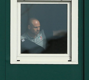 Leicester boss Richard Cockerill watches his side in action from  from a small window in a portacabin as he serves his touch line ban, Leicester Tigers v Worcester Warriors, Aviva Premiership, Welford Road, Leicester, September 8, 2013