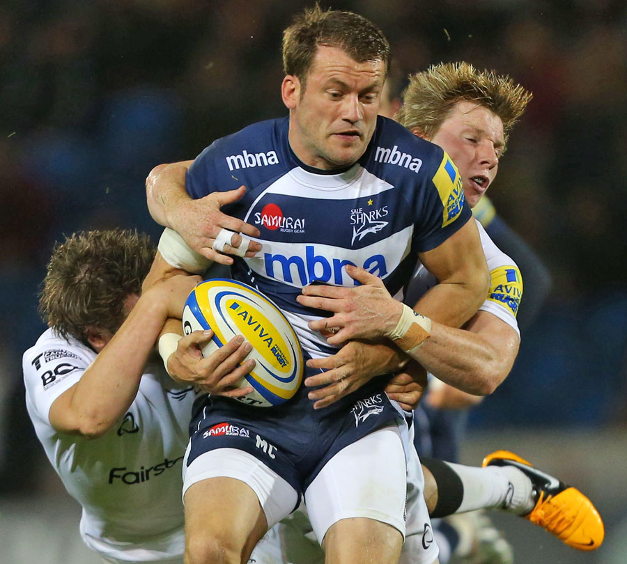 Sale's Mark Cueto is tackled by the Newcastle defence