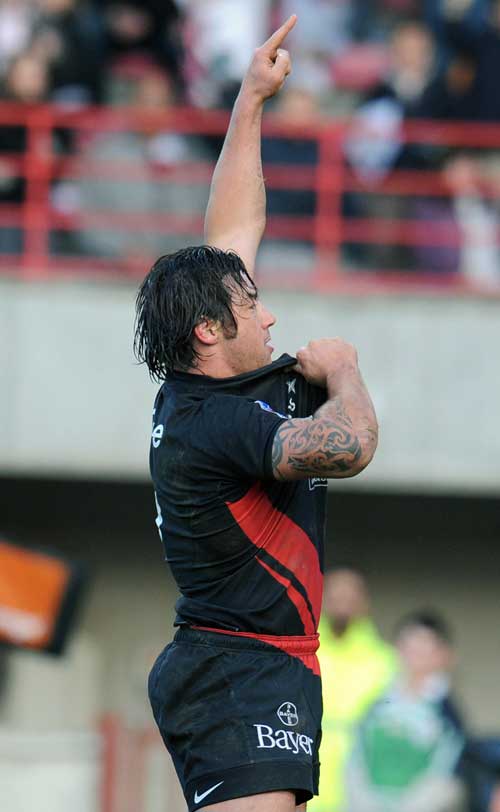 Toulouse's scrum-half Byron Kelleher celebrates after scoring a try 