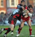 Gloucester's Olly Barkley is tackled by the Saracens defence 