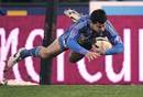 Stade Francais' Guillaume Bousses dives in to score