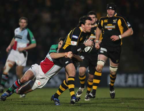 Tom Voyce is tackled by the Harlequins defence