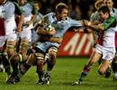Cardiff Blues No.8 Xavier Rush brushes off the attempted tackle of Harlequins' Chris Malone
