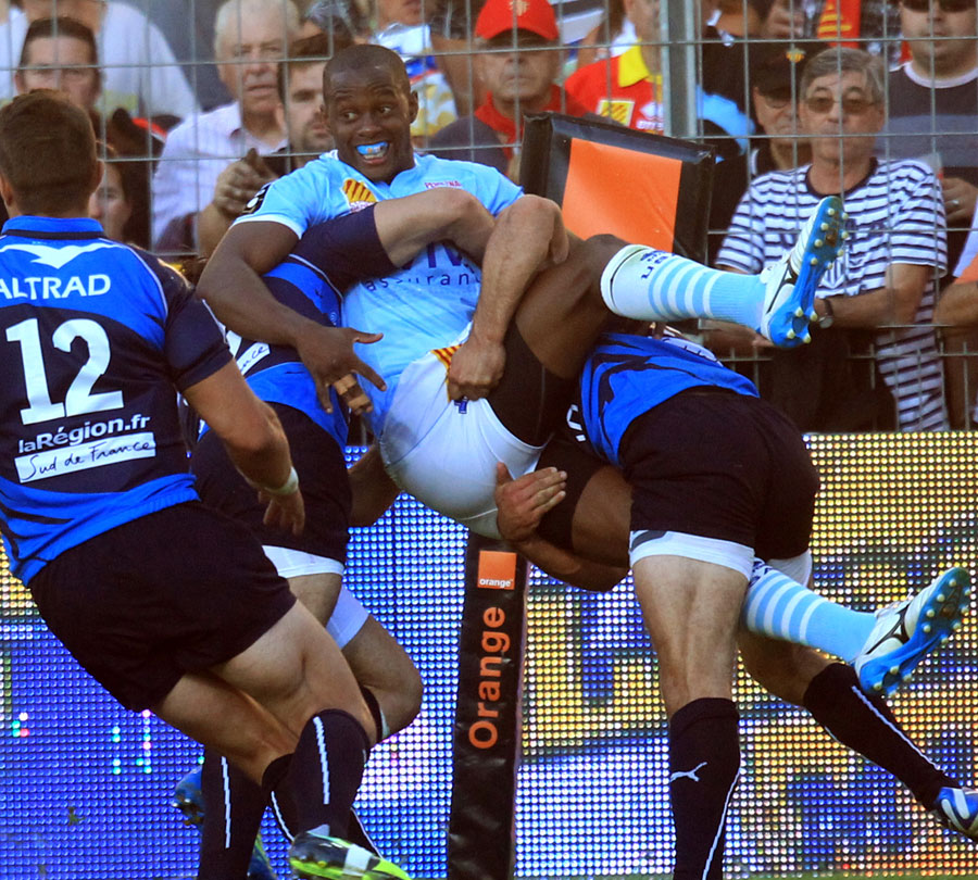 Perpignan's winger Wandile Mjekevu is thwarted by the Montpellier defence