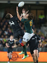 New Zealand's Ben Smith takes on Zane Kirchner for a high ball