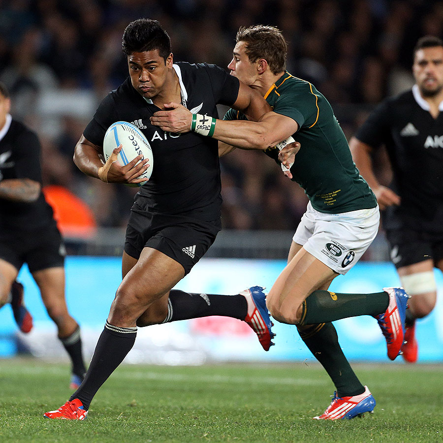 New Zealand's Julian Savea brushes off South African defenders
