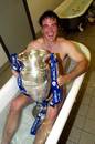 Fraser Waters uses the Premiership trophy to hide his modesty
